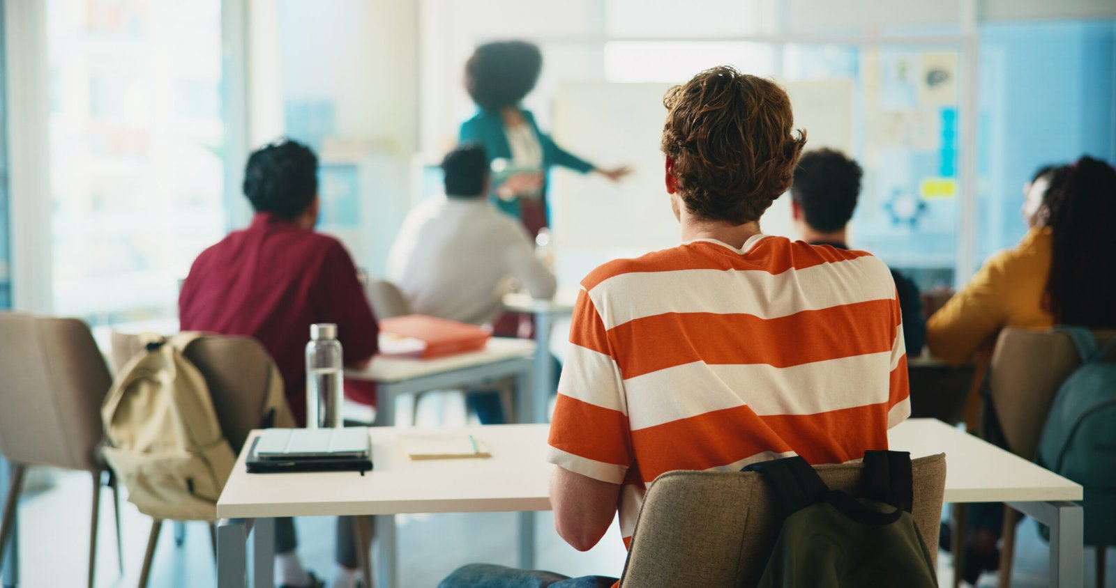 Students attending a counselling session in a classroom